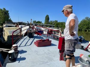 Contemplating the prep before repainting the foredeck.