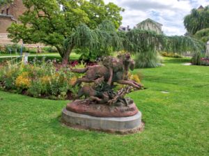 Rather confronting sculpture of a wolf taking a lamb