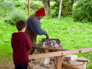 Melting the pewter over a charcoal fire