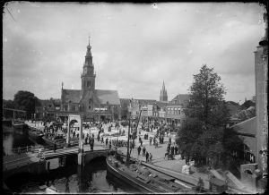 Circa 1930: Panorama from Voordam showing cheese market, weigh house, Houttil, Schapenbrug.