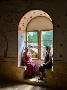 Lisette and Barbara relaxing in a painted alcove.