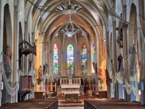 Looking towards the altar, with fishing nets, models and photos as decoration.